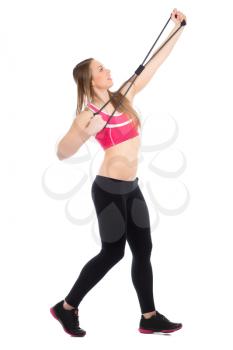 Young woman wearing black leggings and pink top posing with expander. Isolated on white