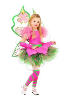 Smiling little blond girl showing her pink carnival costume. Isolated on white