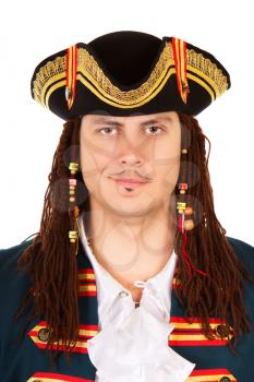 Portrait of grinning man wearing pirate costume and cocked hat. Isolated on white