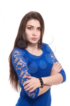 Portrait of attractive young brunette in blue dress. Isolated on white