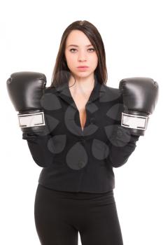 Young brunette wearing black jacket and boxing gloves. Isolated on white
