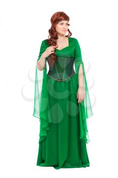 Thoughtful young woman wearing green long dress. Isolated on white