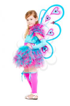 Pretty smiling girl posing in blue and pink butterfly costume. Isolated on white