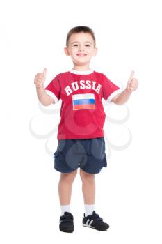 Nice little boy posing in Russian football uniform. Isolated on white