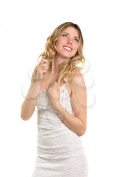 Pretty smiling blond lady posing in white dress. Isolated