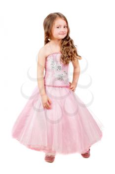 Beautiful curly little girl posing in pink dress. Isolated on white