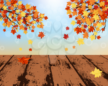 Autumn frame with maple leaves and grunge wooden table in perspective