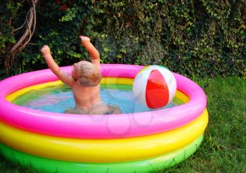Royalty Free Photo of a Little Boy in a Pool