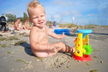 Royalty Free Photo of a Boy Playing on the Beach