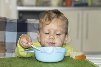 Royalty Free Photo of a Little Boy Eating