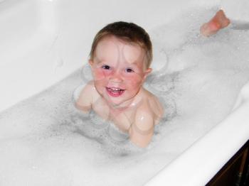 Royalty Free Photo of a Little Boy in a Bathtub