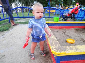 Royalty Free Photo of a Little Boy Playing at a Playground