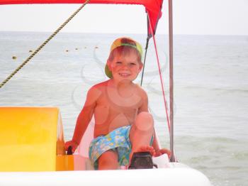 Royalty Free Photo of a Boy on a Boat