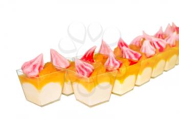 Desserts in glasses on a white background