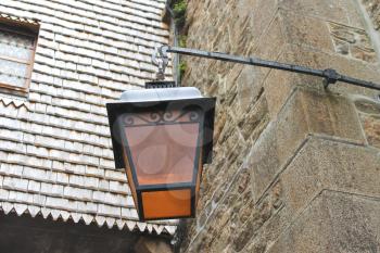 Lantern on the facade of old French house 