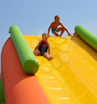 Royalty Free Photo of Children on a Water Slide