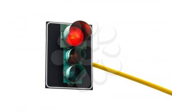 Traffic light isolated on white background is lit red 