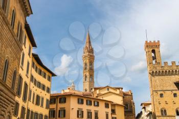 Bell tower of Palazzo del Bargello and church spire of Badia Fiorentine   in Florence, Italy 