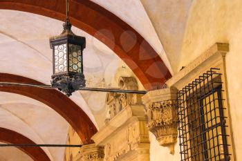Ancient lantern in the courtyard of the Palazzo Comunale in Bologna. Italy