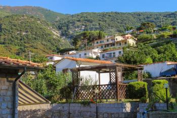 Picturesque houses on the hill in small town Marciana Marina on Elba Island, Italy