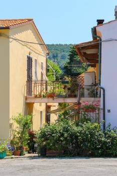 Narrow street of small picturesque Italian town on Elba Island, Italy