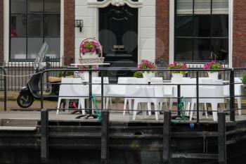Small cafe on the waterfront near Spaarne river in Haarlem, the Netherlands
