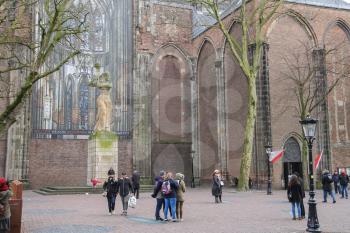 Utrecht, the Netherlands - February 13, 2016: People walking near St. Martins Cathedral in the historic city centre