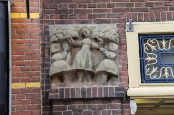 Ancient building with bas-relief in historic centre of Utrecht, the Netherlands