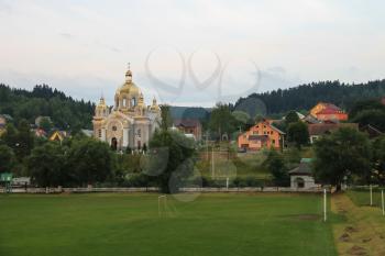 Panorama of Schodnica on slope of forested mountains. Carpathians, Ukraine