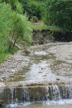 Flowing water in mountain stream. Carpathians, Ukraine