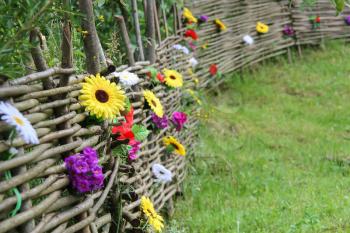 Old Ukrainian style fence with decorative flowers