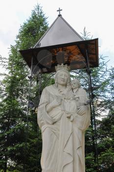Schodnica, Ukraine - July 03, 2014: Statue of Virgin Mary, Mother of God in Carpathians