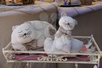 Grazzano Visconti, Italy - August 07, 2016: Decorative sleeping cats in souvenir shop