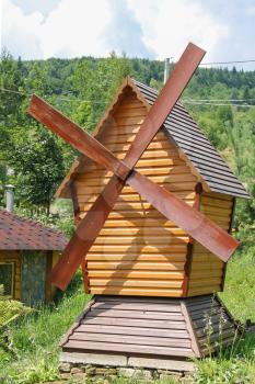 Decorative wooden mill. Carpathians, Ukraine