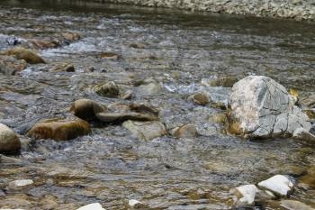 Large rocks in river water. Carpathians, Ukraine