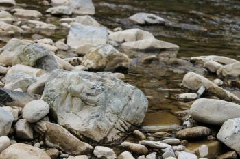 Large rocks in river water. Carpathians, Ukraine