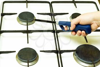 Royalty Free Photo of a Person Lighting a Gas Stove