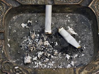 Royalty Free Photo of Cigarette Butts in an Ashtray
