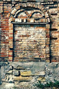arch of an old brick wall of a house