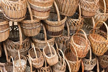 many different wicker baskets as a background