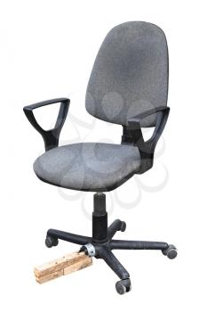 Old office chair with a piece of wood instead of a broken leg Isolated on a white background