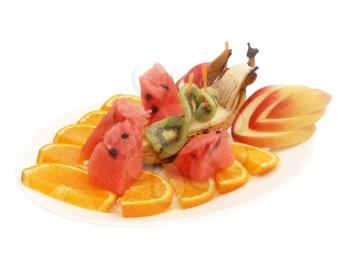 Assorted fruits on a plate isolated on a white background