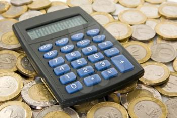 Royalty Free Photo of a Calculator on Coins