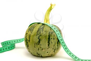 Royalty Free Photo of a Vegetable With Measuring Tape