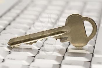 Royalty Free Photo of a Key on a Laptop