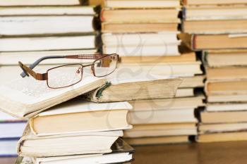 Royalty Free Photo of a Pair of Glasses on Books