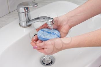 Royalty Free Photo of a Woman Washing Her Hands