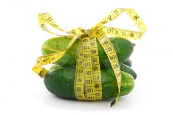 Royalty Free Photo of Cucumbers in Measuring Tape