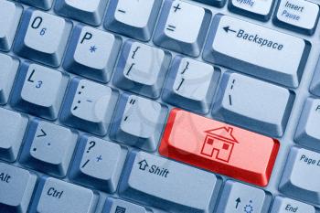 Royalty Free Photo of a Keyboard With a House Icon
