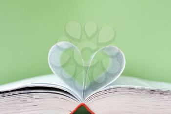 Royalty Free Photo of a Heart Shape in a Book